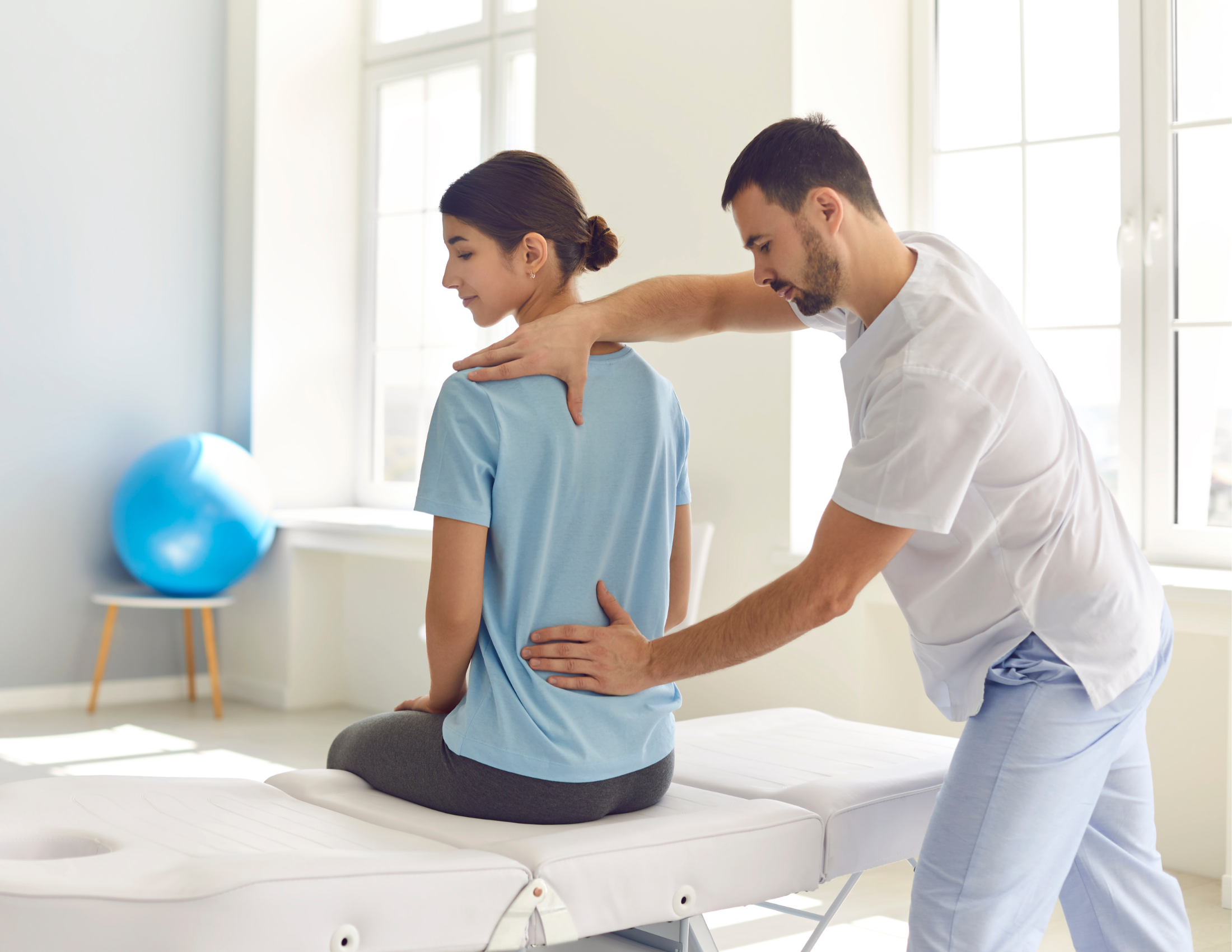 Chiropractor helping bad back